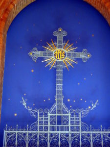 Gilded iron cross and stars in the Day Chapel at All Saints Church, Dulwich, London